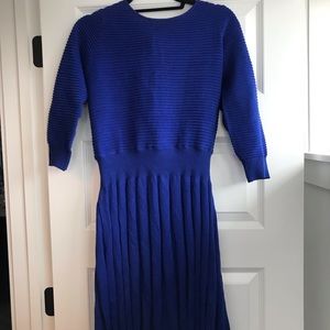 Blue blouse and pleated skirt dress